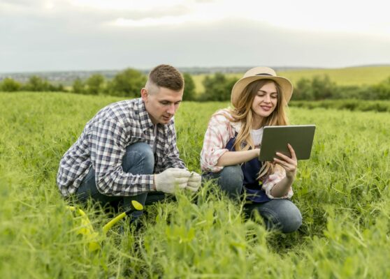 couple-working-farm-with-tablet